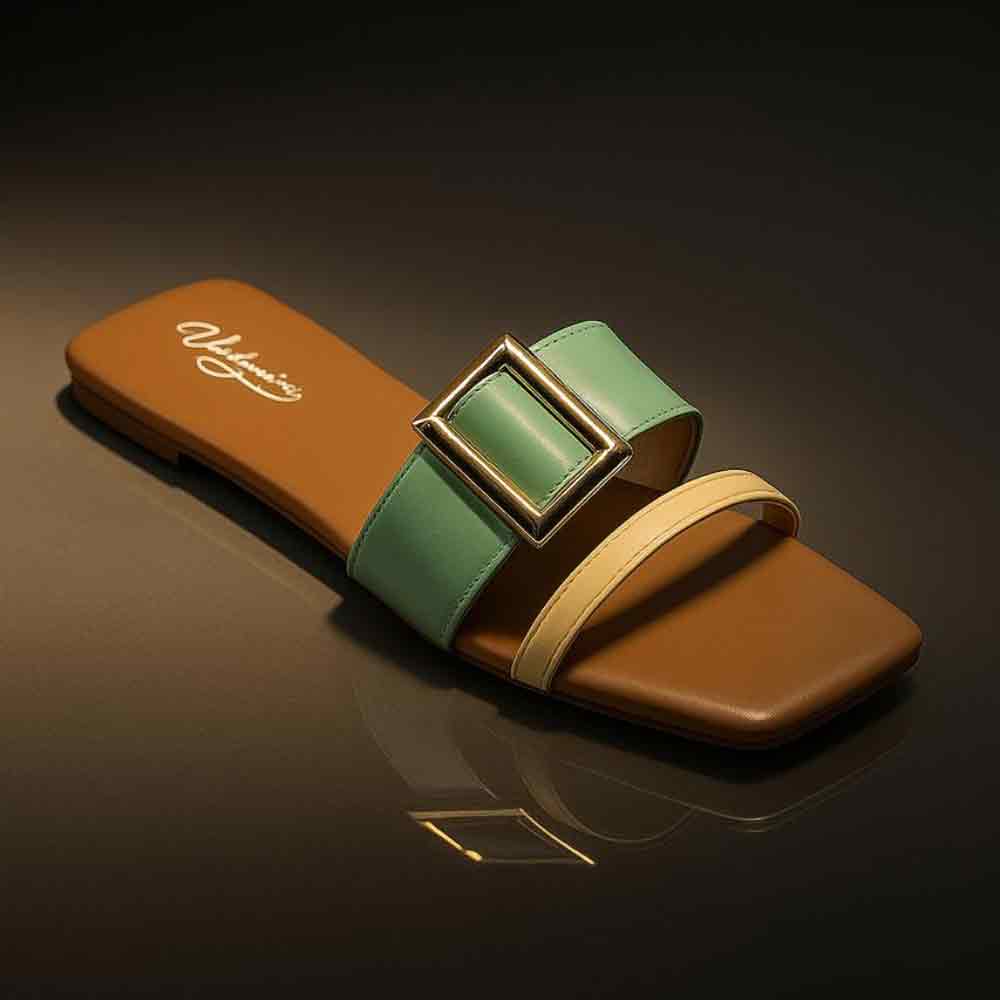 Slide sandal with brown and green strap on a reflective surface