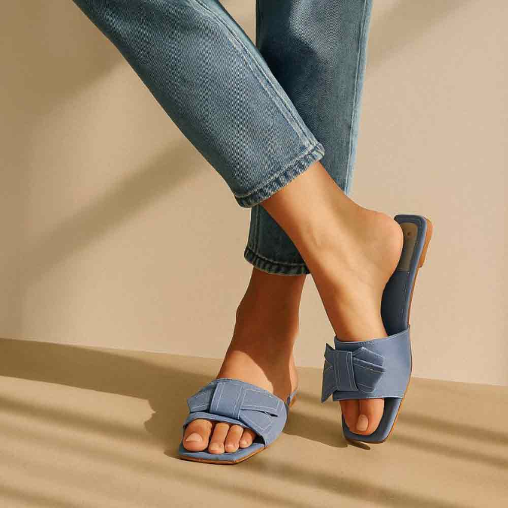 Close-up of blue Denim Cloud flats showing denim texture and details
